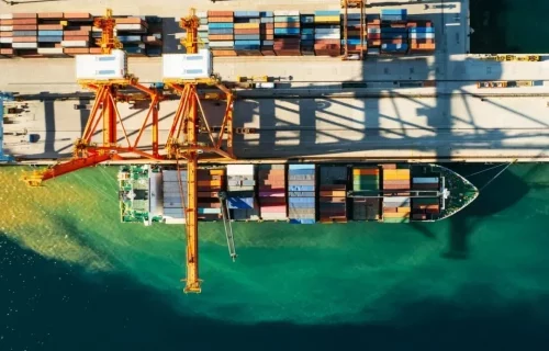aerial-view-of-containers-loading-and-unloading-to-the-ship-in-the-sea-port-logistic-and-e1665494933937-q2t229mgxw27a9pnuhxrroxjm5iaq15zg6t31pos5c